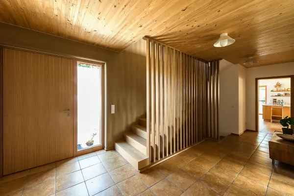 massivholzhaus, steinboeden, naturstein, holzhaus, holzhausbau, hausbau, neubau, massivholz, holzfassade, holzdecke